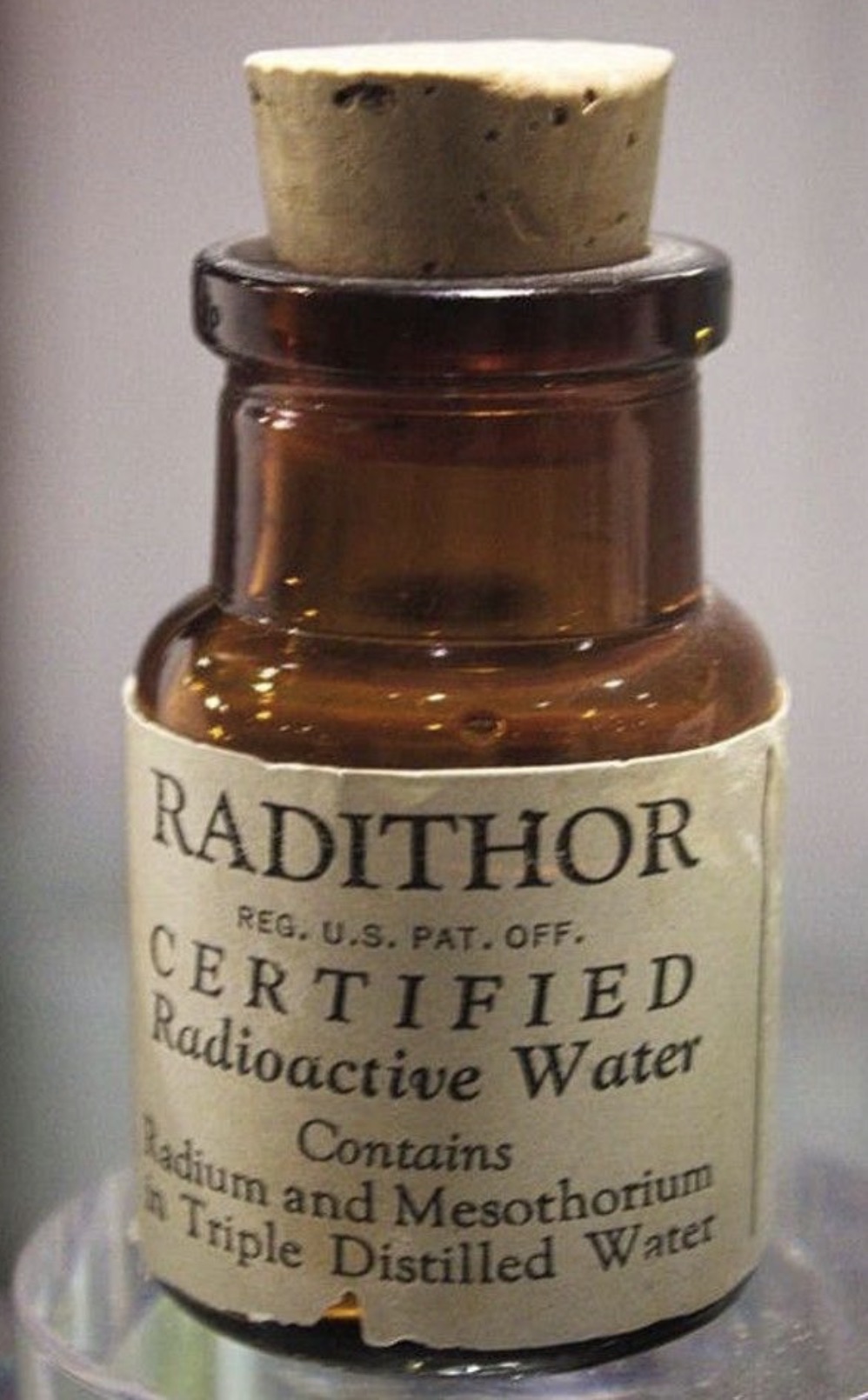 glass bottle - Radithor Reg. U.S. Pat. Off. Certified Radioactive Water Contains Radium and Mesothorium Triple Distilled Water